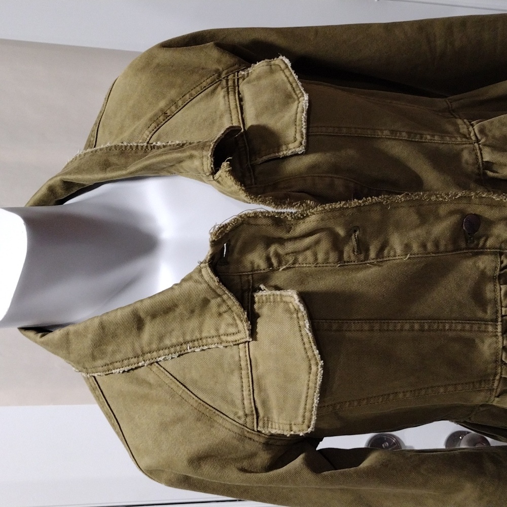 Free People womens green cotton jeans jacket with ruffle hem. Size small
